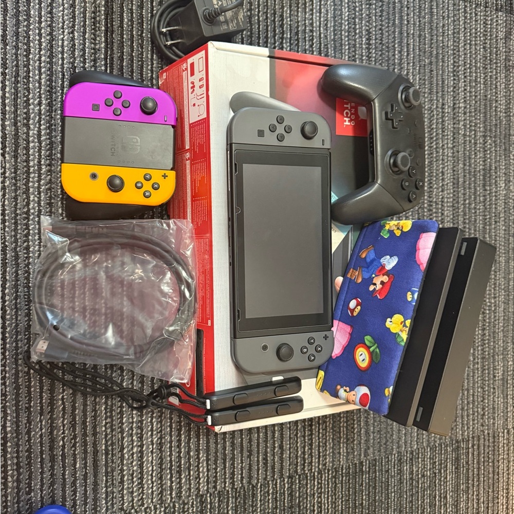 Nintendo Switch Console with Gray, Purple, and Yellow Joy-Con